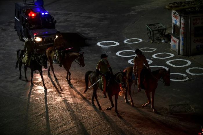 Police patrol in India's Gujarat state earlier this week during a nationwide coronavirus lockdown