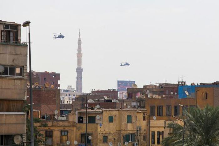 Egyptian air force Apache attack helicopters fly over Cairo on June 2, 2018, as Egyptian President Abdel-Fattah al-Sisi is sworn in for a second four-year term
