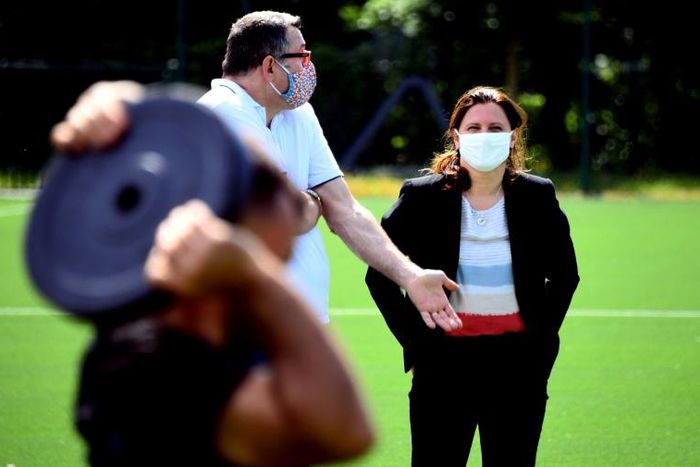 French Sports Minister Roxana Maracineanu talked to the head of the national judo team, Stephane Traineau, during a visit to the national sports training institute on Monday