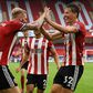 Oliver McBurnie (L) and Sander Berge (R) scored for Sheffield United against Tottenham