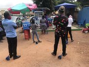 Waakye seller and her customers