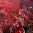 Thousands of Liverpool fans celebrated a first league title in 30 years outside Anfield