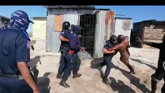 Police officers drag bathing man from his shack to enable them demolish his place of abode (video)