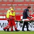 Mainz's Nigerian forward Taiwo Awoniyi, on loan from Liverpool, is stretchered off after suffering a serious head injury in Sunday's relegation battle against Augsburg