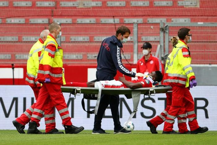 Mainz's Nigerian forward Taiwo Awoniyi, on loan from Liverpool, is stretchered off after suffering a serious head injury in Sunday's relegation battle against Augsburg