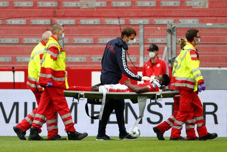 Mainz's Nigerian forward Taiwo Awoniyi, on loan from Liverpool, is stretchered off after suffering a serious head injury in Sunday's relegation battle against Augsburg