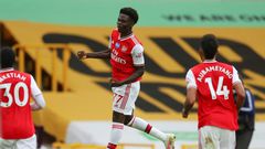 Arsenal's Bukayo Saka celebrates scoring at Wolves