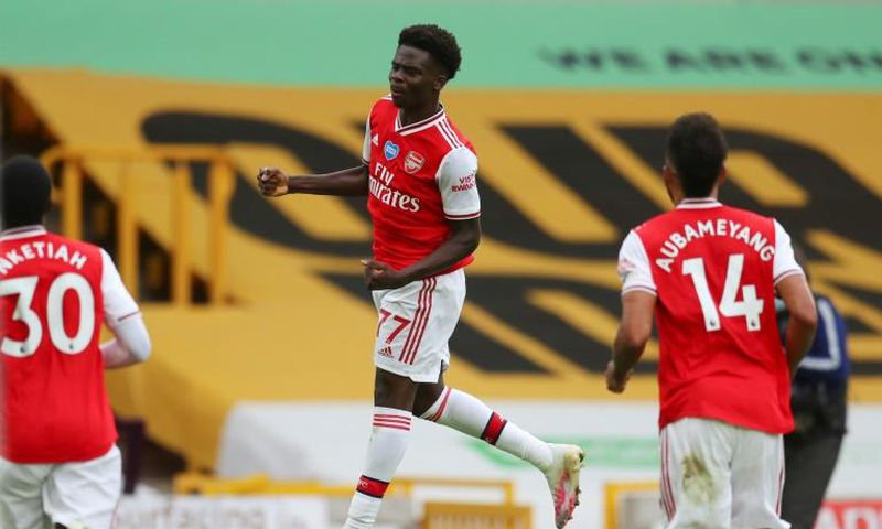 Arsenal's Bukayo Saka celebrates scoring at Wolves