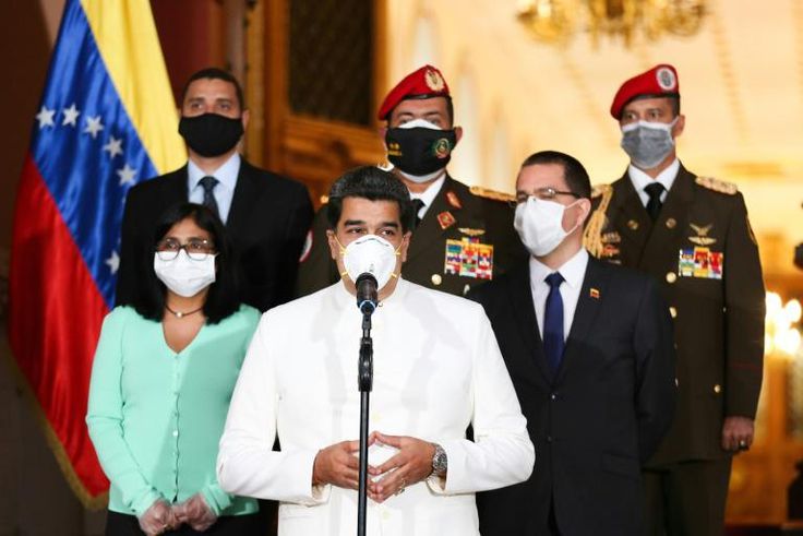 Since 2017, the government of President Nicolas Maduro (C, pictured March 2020) has announced its oil prices in yuan rather than dollars in protest over US sanctions