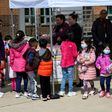Children pick up free lunch in Arlington, Virginia on March 16, 2020, after schools closed due to coronavirus. Disrupted school lunch programs could be a factor in alarming rises in hunger among US children since the outbreak began, the study says