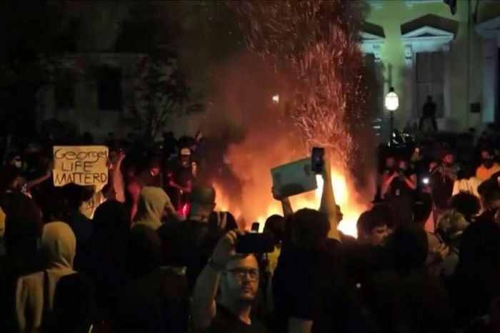Crowds of protesters break curfew in Washington to demonstrate near the White House