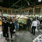 Shoppers clad in protective gear, including face masks and latex gloves, walk through Tajrish Bazaar in Iran's capital Tehran at the start of the Muslim holy month of Ramadan