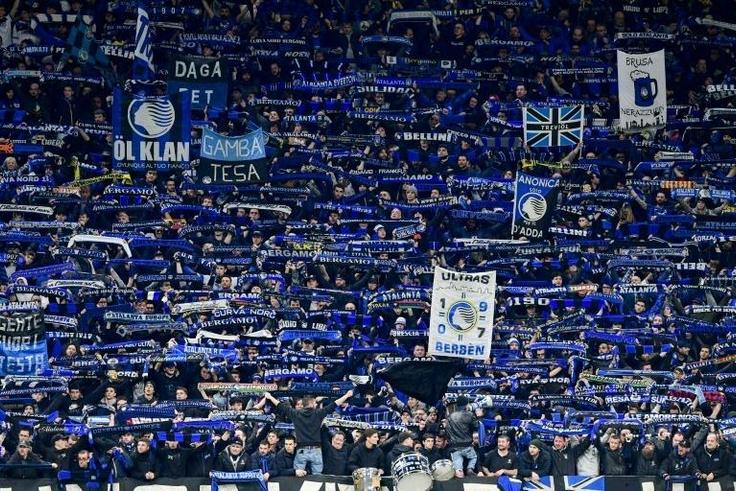 Atalanta fans cheer during the UEFA Champions League football match between against Valencia in Milan's San Siro Stadium on February 19
