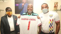 Sefa Kayi in the middle receives a replica jersey