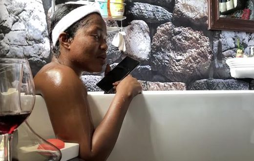 MzBel grants interview from her bathtub