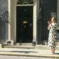 British Prime minister Boris Johnson and 'Clap for Carers' founder Annemarie Plas clap for the NHS outside 10 Downing street