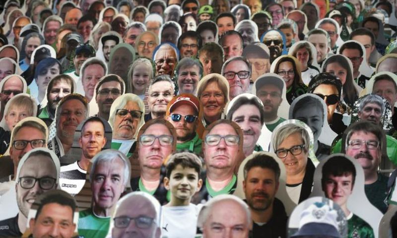 Still life: Cardboard cutouts of fans at the Borussia Moenchengladbach v Bayer Leverkusen game