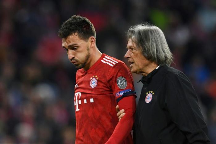 Hans-Wilhelm Mueller-Wohlfahrt pictured helping Mats Hummels off the pitch when he played for Bayern Munich in October 2018