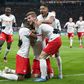 RB Leipzig, seen here celebrating a goal against Tottenham, are working on modified goal celebrations -- to avoid contact -- when the Bundesliga resumes Saturday.