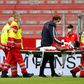Mainz forward Taiwo Awoniyi is stretchered off after suffering a serious head injury in Sunday's relegation battle against Augsburg