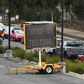 A long queue of cars wait at a drive-through COVID-19 testing site in Melbourne
