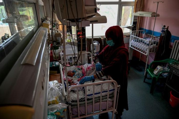 A nurse takes care of newborn babies rescued and brought to the Ataturk Children Hospital after their mothers were killed in an attack on a Kabul maternity hospital