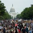 A crowd of protesters walk from the Capitol building to the White House during a peaceful protest against police brutality and racism, on June 6, 2020 in Washington, DC