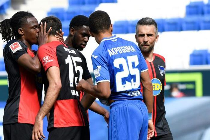 Hertha Berlin's Dedryck Boyata celebrates with teammate Marko Grujic during Saturday's win at Hoffenheim