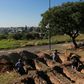 Grave diggers prepare plots at the San Vicente cemetery in Cordoba following a spike in coronavirus cases