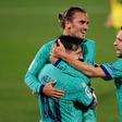 Antoine Griezmann celebrates with Lionel Messi after scoring a sensational chip against Villarreal on Sunday.