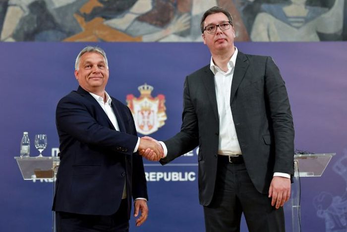 Serbian President Aleksandar Vucic (R) has deftly brought the media to heel using the same 'illiberal toolbox' as Hungary's Viktor Orban, according to the US-based Freedom House
