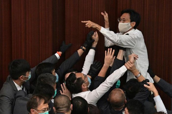Hong Kong's legislature has been paralysed for seven months as pro-democracy politicians attempt to scupper a controversial law that bans insulting China's national anthem