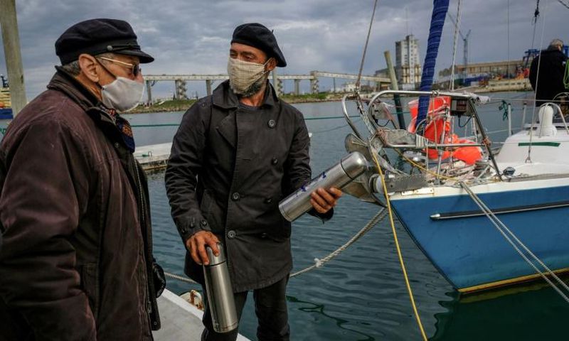 Juan Manuel Ballestero (R), with his father Carlos in Mar del Plata, Argentina, after sailing home from Portugal due to pandemic travel restrictions to see his parents