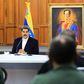 President Nicolas Maduro, shown in a handout picture released by the Venezuelan Presidency speaking to members of the Bolivarian National Armed Forces (FANB), announced that two Americans were arrested for taking part in the failed "invasion"