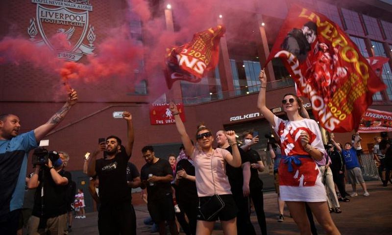 Fans celebrate outside Anfield