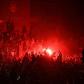 Fans celebrate Liverpool winning the Premier League title outside Anfield