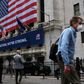 The New York Stock Exchange, the symbolic heart of Wall Street, reopened its floor after a two-month closure due to the coronavirus, with traders donning masks and separated by plexiglas