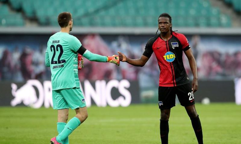 Hertha Berlin goalkeeper Rune Jarstein (L) celebrates with defender Dedryck Boyata after Wednesday's 2-2 draw at RB Leipzig.