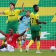 Manchester United forward Victor Ighalo is floored by a foul which resulted in Norwich City defender Timm Klose (L) beind red-carded