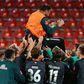BClaudio Pizarro, 41, is cheered by his Werder Bremen team-mates as he retired after their relegation/promotion play-off on Monday at Heidenheim.