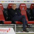 Waiting game: Freiburg coach Christian Streich (left) sits on the bench prior to Friday's game