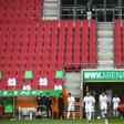 Is there anybody there? Wolfsburg players come onto the pitch prior to their game at Augsburg