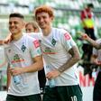 Bremen players Milot Rashica (L) and Joshua Sargent celebrate after Saturday's league win put them into the Bundesliga's relegation/promotion play-off against Heidenheim.