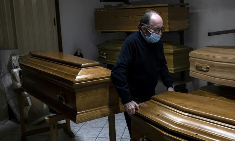 Giampiero Palmero, owner of a funeral home in Revello, laments having to seal coffins quickly before family can bid farewell to loved ones, as the coronavirus alters funeral traditions in Italy