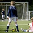 Dutch children play football during the first reopening day of youth training camps in the Netherlands after the coronavirus covid-19 outbreak in The Hague, on April 29, 2020