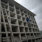 A worker builds vertical graves during the COVID-19 coronavirus pandemic at the Caju Cemetery in Rio de Janeiro, Brazil