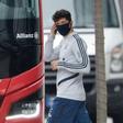 Bayern Munich forward Robert Lewandowski wears a mask as he leaves a training session