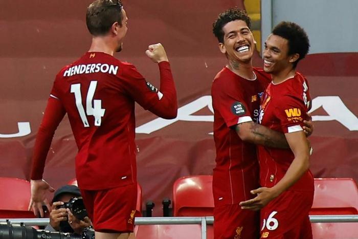 Liverpool captain Jordan Henderson (left) hailed the impact of manager Jurgen Klopp on the club