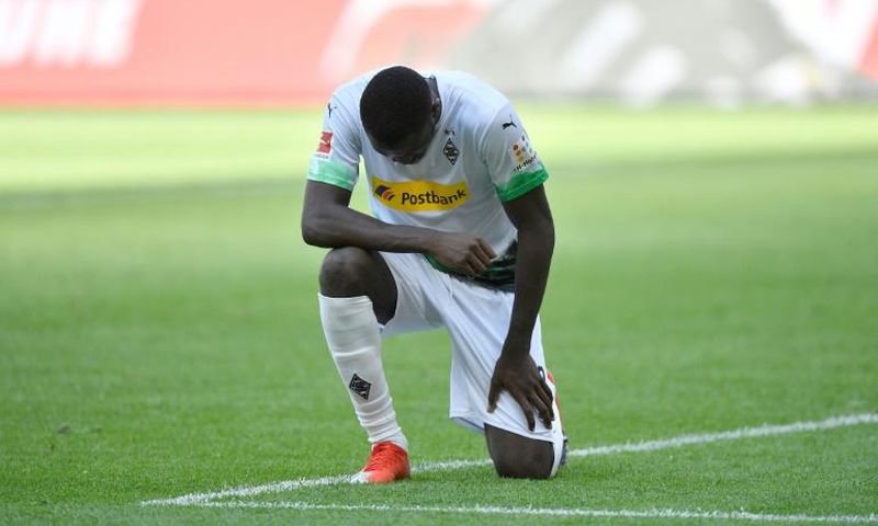 Moenchengladbach forward Marcus Thuram takes a knee after scoring in Sunday's 4-1 win at home to Union Berlin