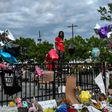 A man stands outside a burned Wendy's restaurant in Atlanta, where police shot dead Rayshard Brooks in the parking lot, setting off protests -- the US is against a possible racism inquiry by the UN Human Rights Council